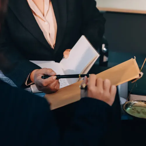 Judge gavel with Justice lawyers, Business woam in suit or lawyer working on a documents. Legal law, advice and justice concept.